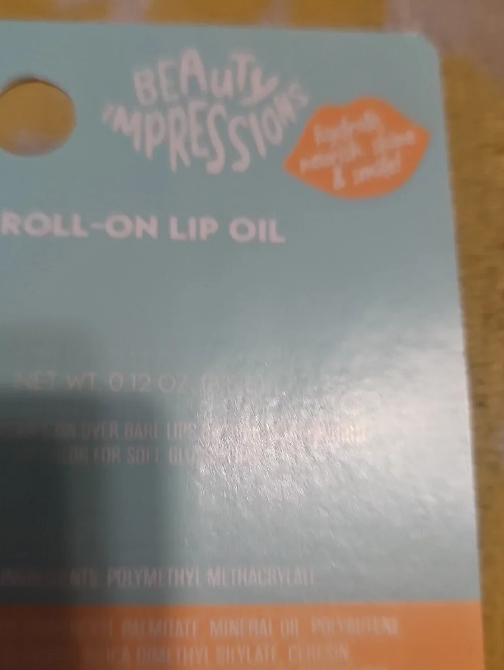 Impressions Roll-On Lip Oil in Orange Cap with Pastel Beads